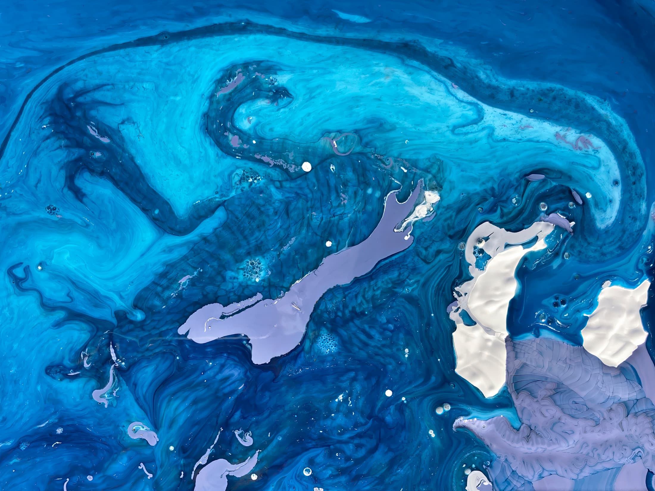 Schenectady, New York. Abstract photographic image featuring swirling blues and purples with white and pale accents. The composition evokes fluid motion, ocean currents, and dreamlike energy.